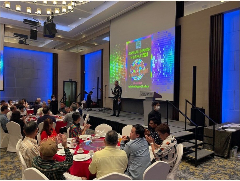 Event emcee hosting a corporate dinner and dance for BounceParkSG