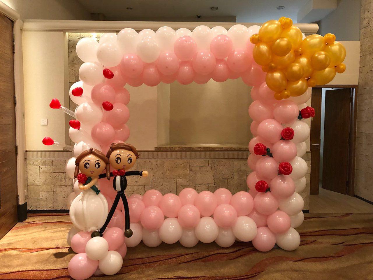 Customized balloon photo frame arch by BounceParkSG
