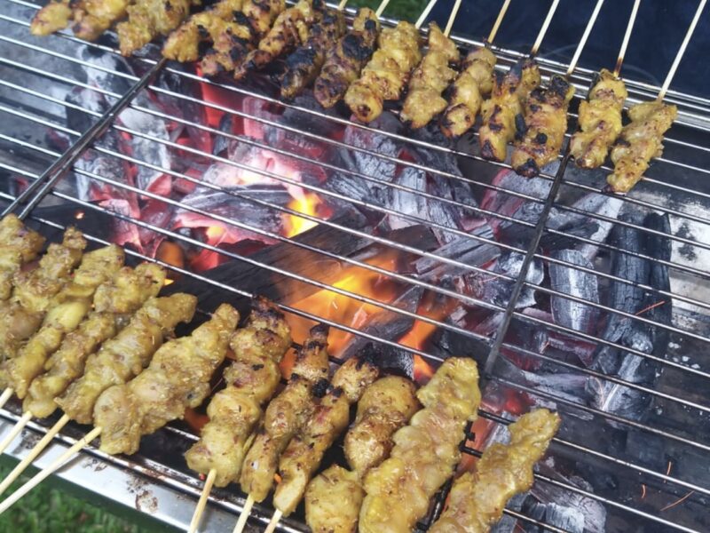 Satay grilling on charcoal at a BounceParkSG event
