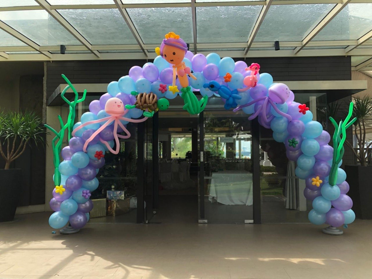 Pastel balloon arch at an event entrance