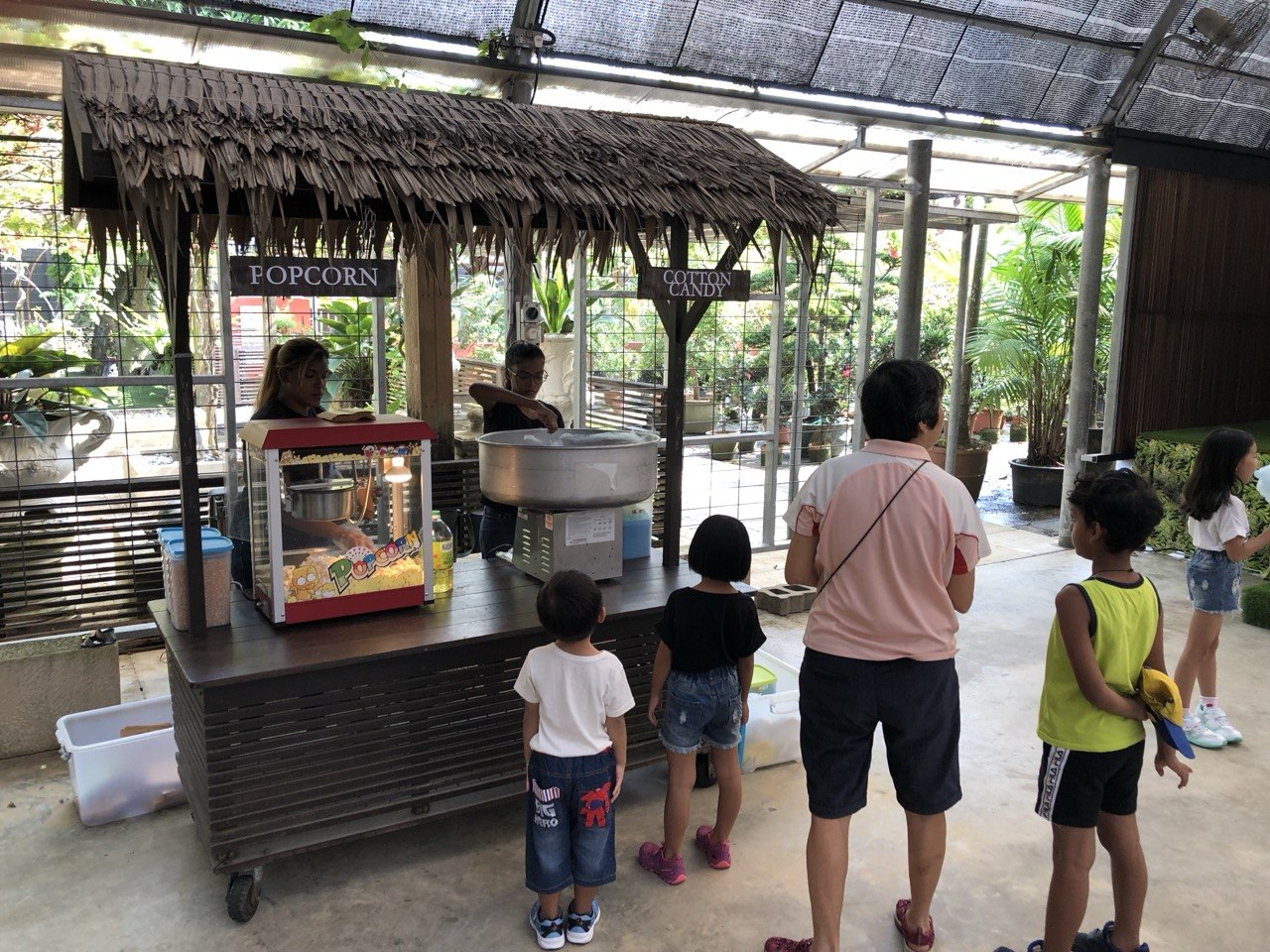 Family at a carnival popcorn cart